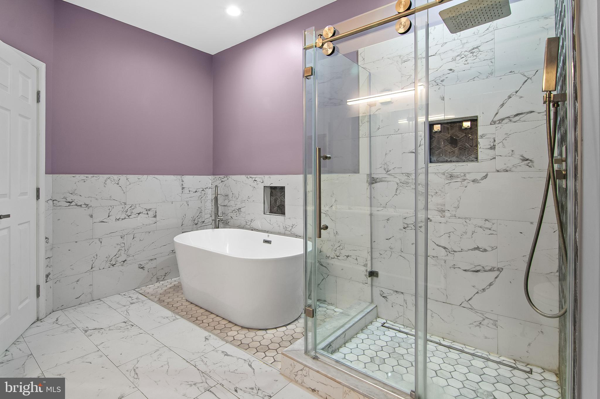 108 Lancefield Road Baltimore, MD 21209 - Photo 23 of 28 a bathroom with a bathtub and shower