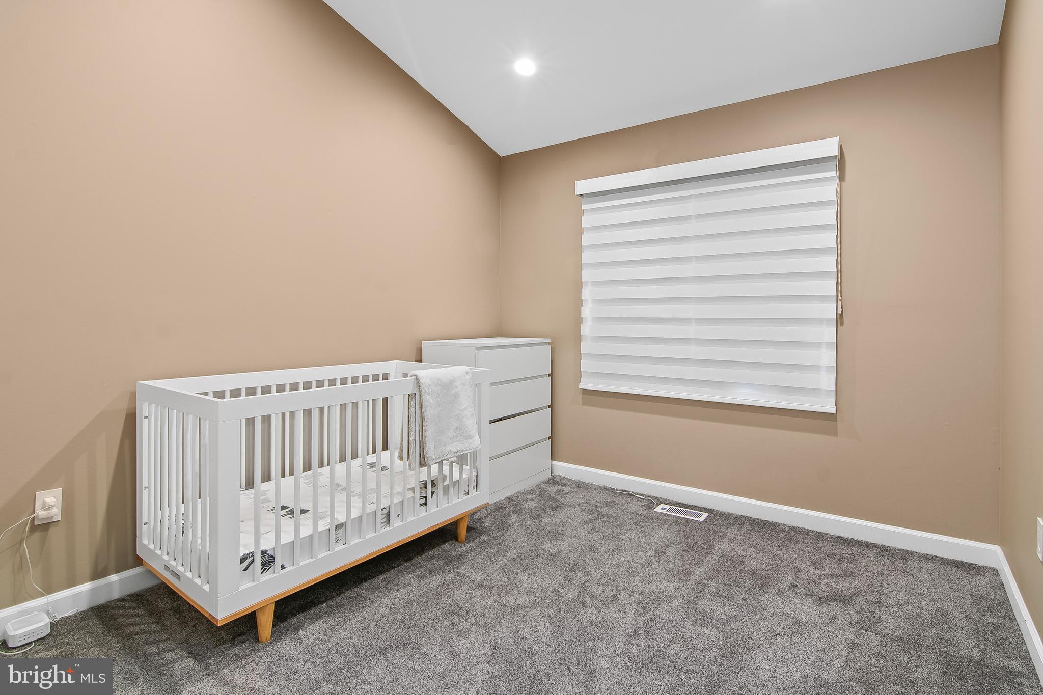108 Lancefield Road Baltimore, MD 21209 - Photo 24 of 28 a bedroom with a bed and a window