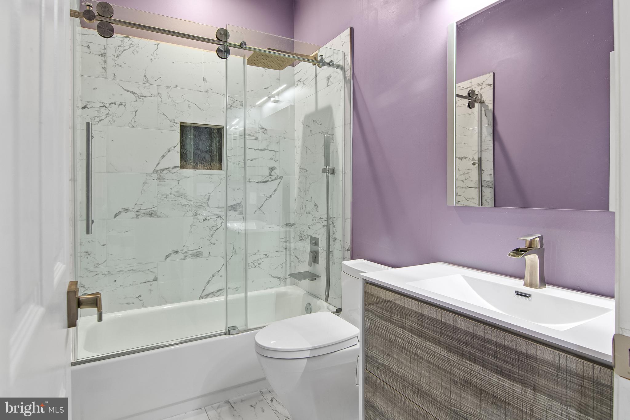 108 Lancefield Road Baltimore, MD 21209 - Photo 26 of 28 a bathroom with a sink toilet and shower