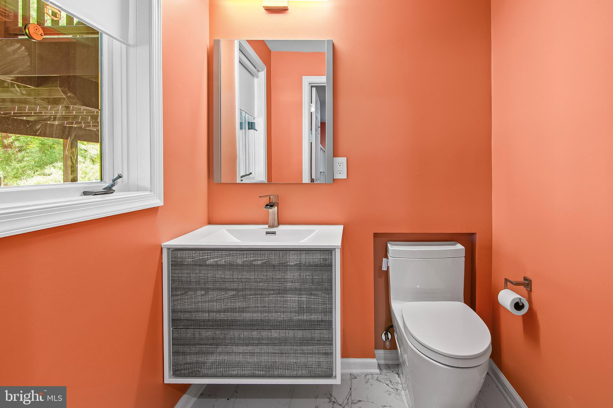 108 Lancefield Road Baltimore, MD 21209 - Photo 6 of 28 a bathroom with a toilet and a sink