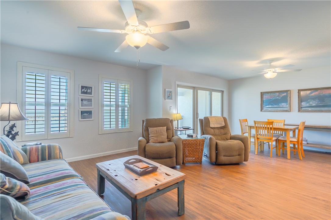620 Fulton Beach Road, Unit 708 Rockport, TX 78382 - Photo 10 of 38 a living room with furniture two night stand and a large window