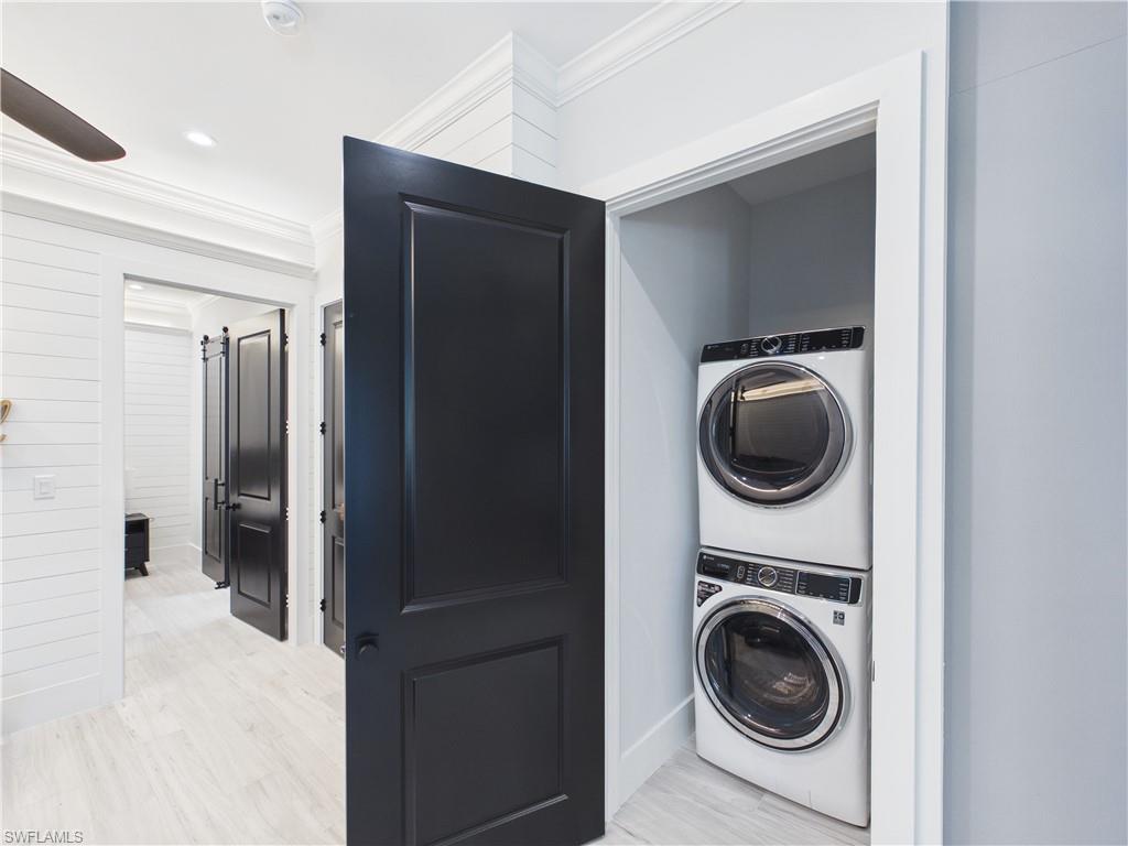 3650 Sunset Boulevard Naples, FL 34112 - Photo 23 of 26 Stacked washer and dryer unit within a dedicated closet