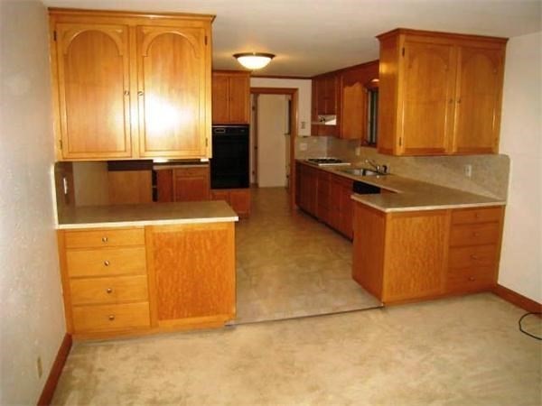 27 Hampden Road Framingham, MA 01702 - Photo 6 of 8 a kitchen with sink and cabinets