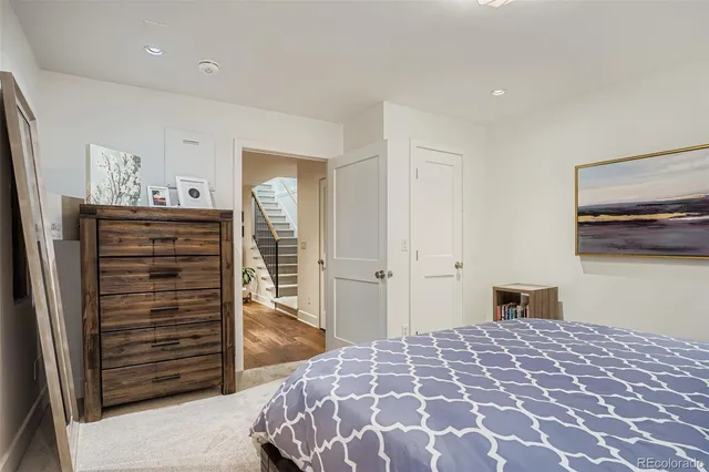a bedroom with a bed and cabinets