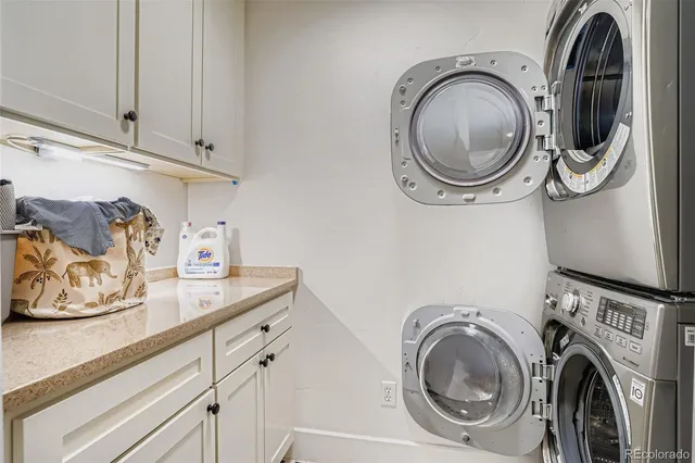 a utility room with sink dryer and washer
