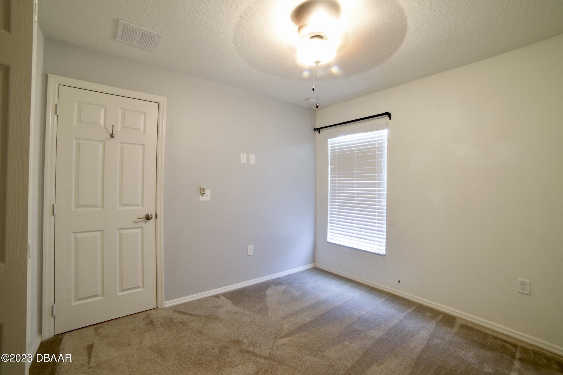 63 Levee Lane Ormond Beach, FL 32174 - Photo 11 of 41 a view of an empty room with a window