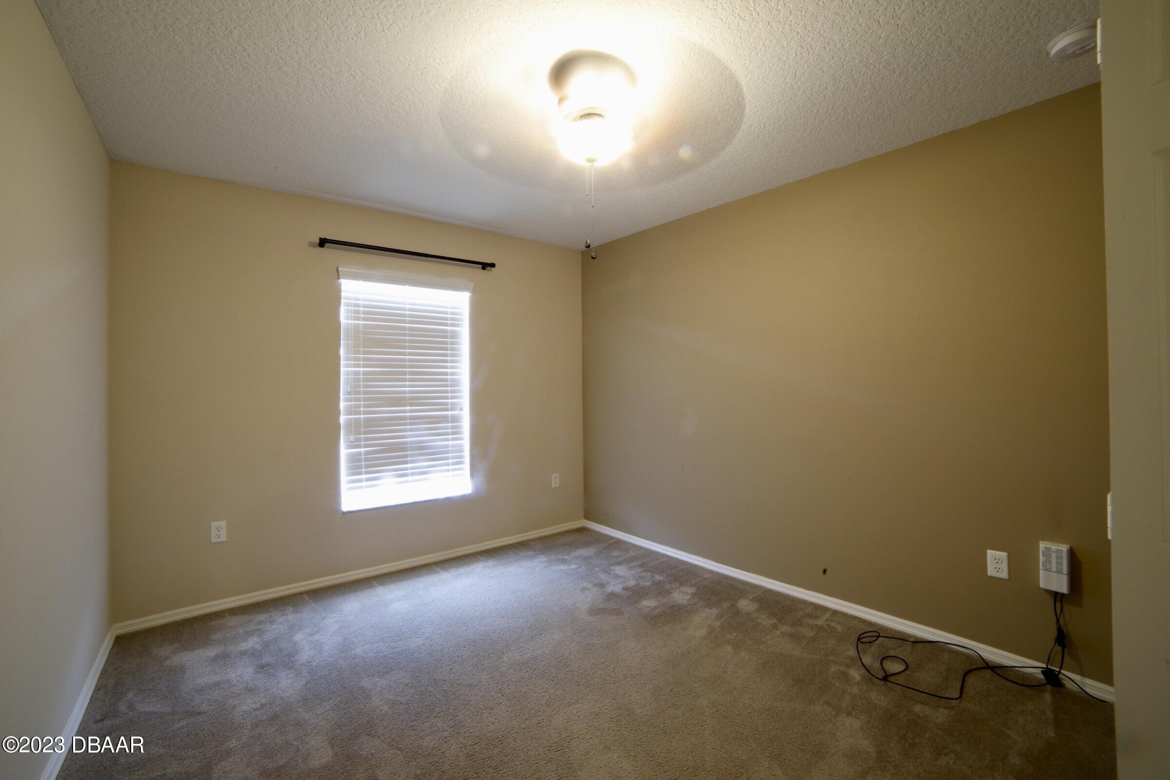 63 Levee Lane Ormond Beach, FL 32174 - Photo 15 of 41 an empty room with a window