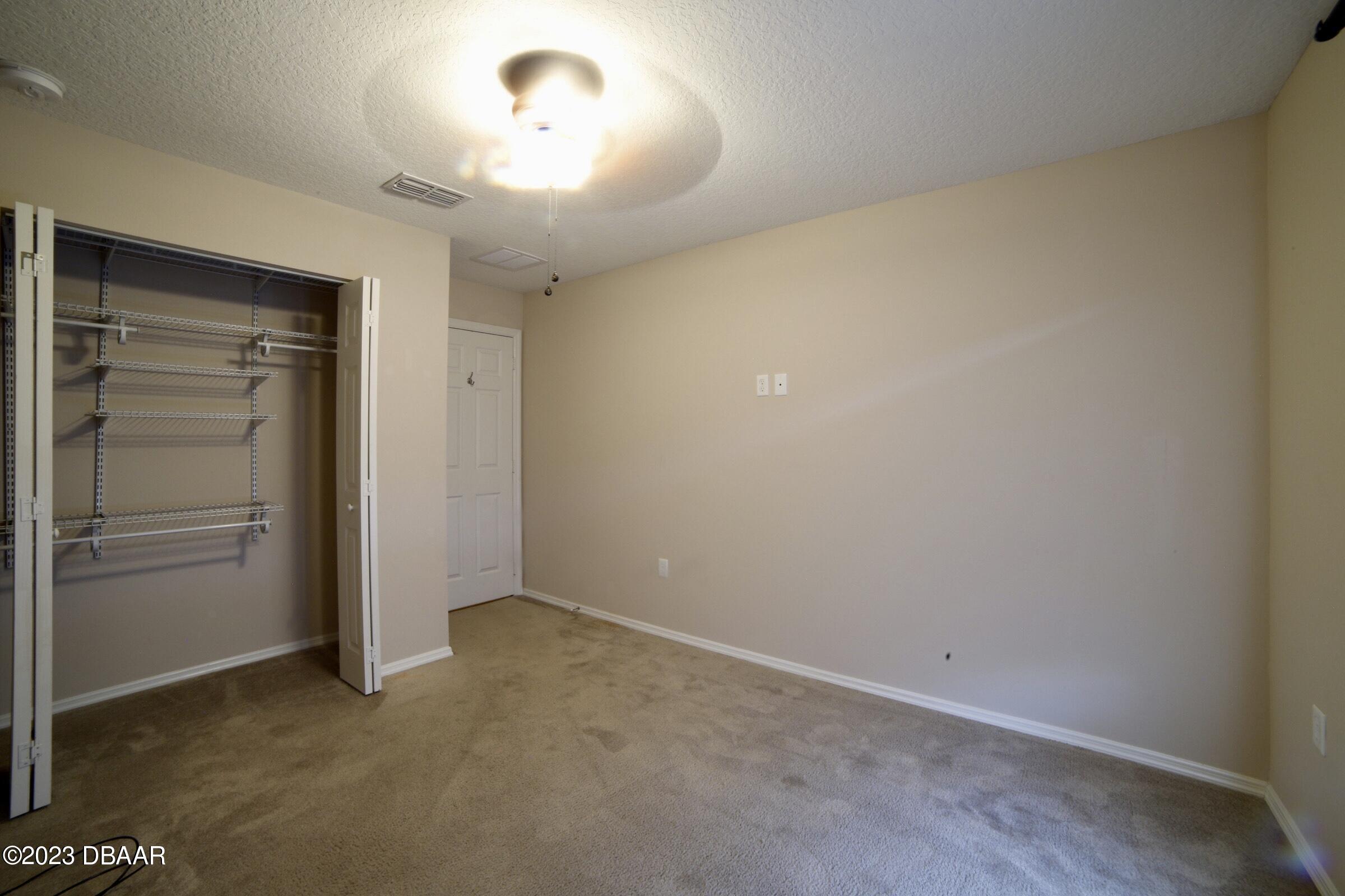 63 Levee Lane Ormond Beach, FL 32174 - Photo 16 of 41 an empty room with closet area