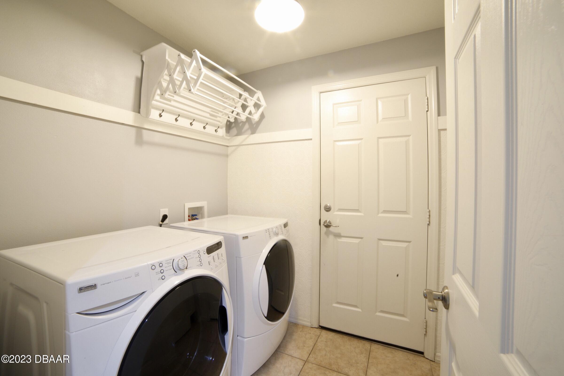 63 Levee Lane Ormond Beach, FL 32174 - Photo 18 of 41 a utility room with dryer and washer