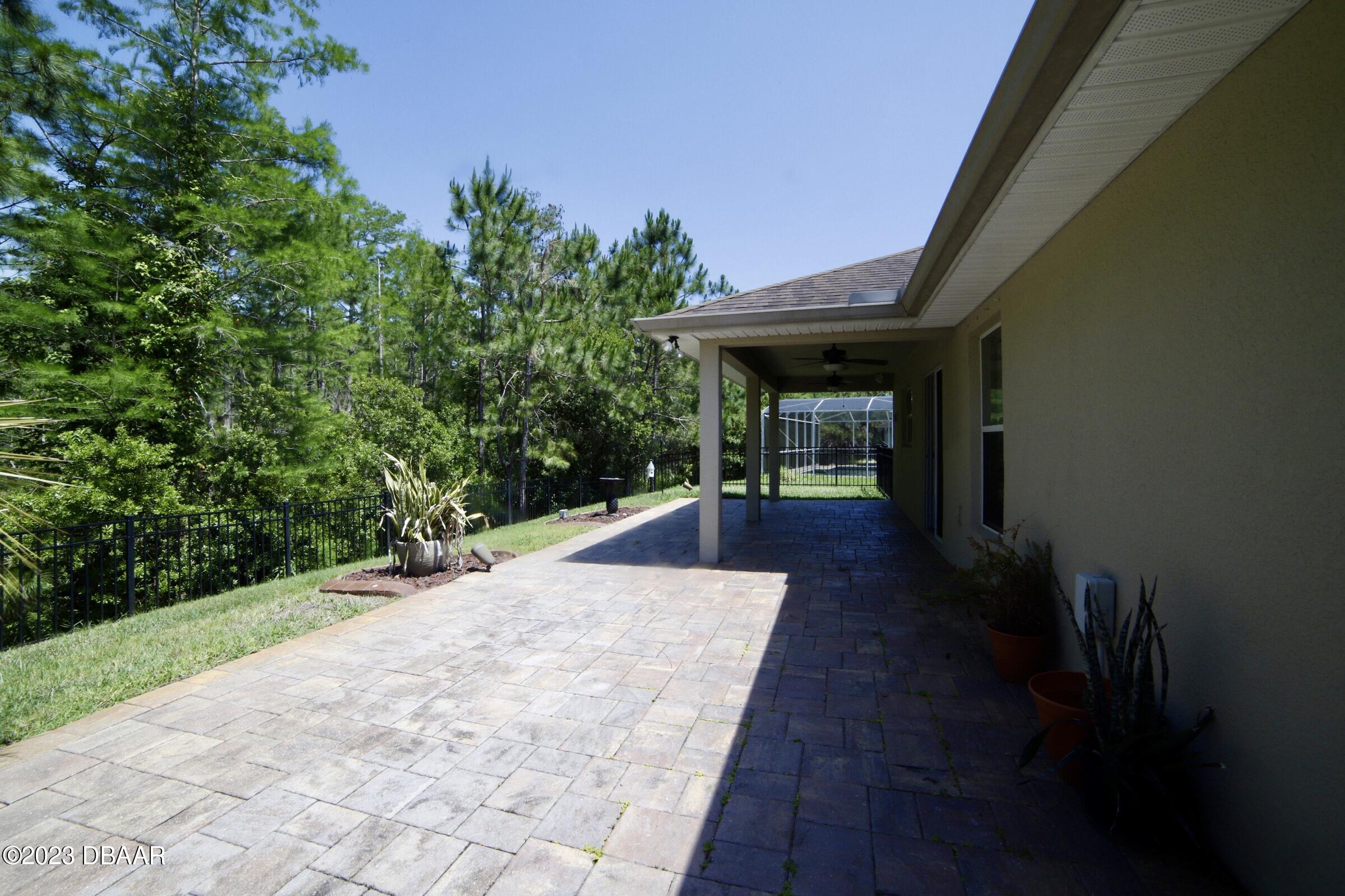 63 Levee Lane Ormond Beach, FL 32174 - Photo 40 of 41 a view of a pathway both side of the house