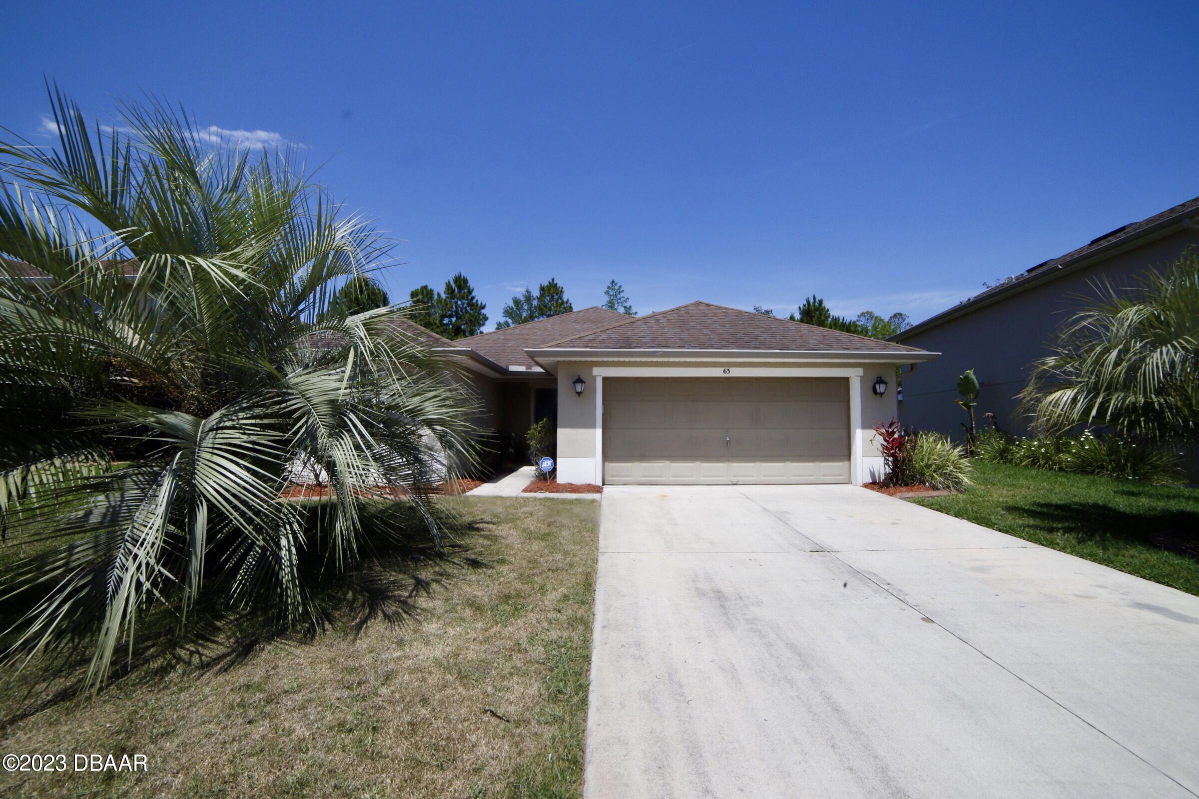 63 Levee Lane Ormond Beach, FL 32174 - Photo 6 of 41 a view of a house with a yard and plants