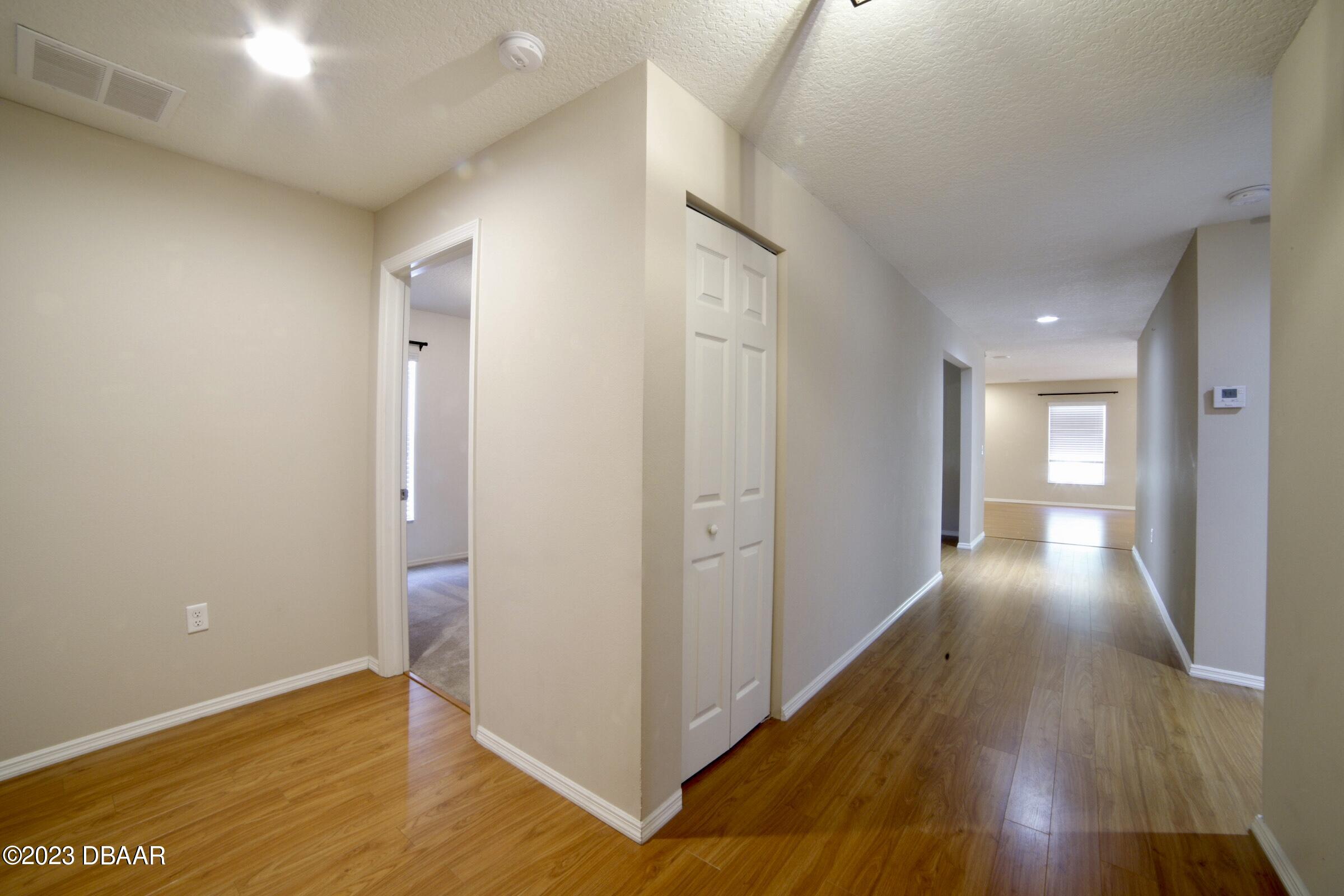 63 Levee Lane Ormond Beach, FL 32174 - Photo 8 of 41 a view of hallway with wooden floor