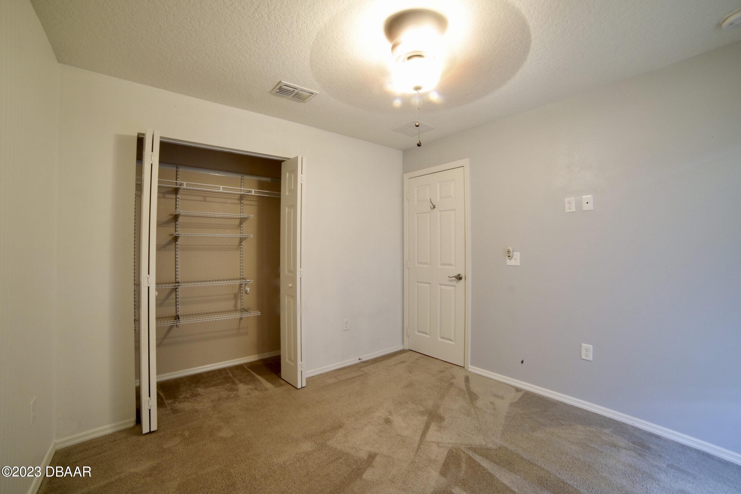 63 Levee Lane Ormond Beach, FL 32174 - Photo 10 of 41 an empty room with a empty space