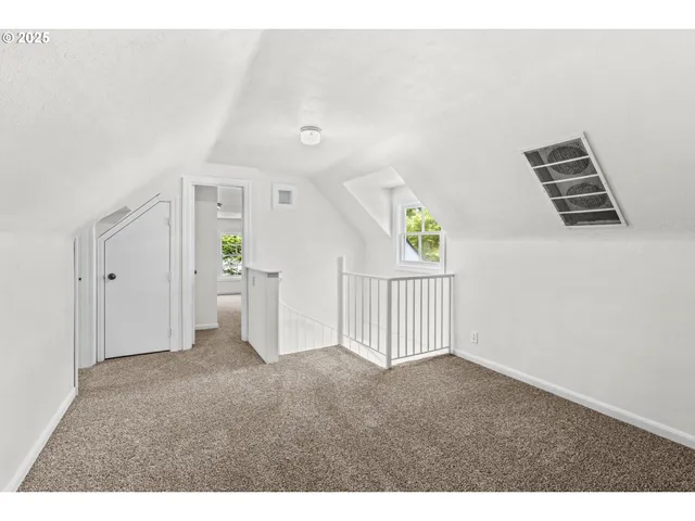 a view of empty room with windows