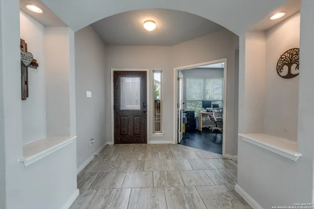 a view of a livingroom and a hallway