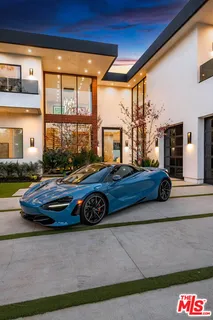 a car parked in front of a house
