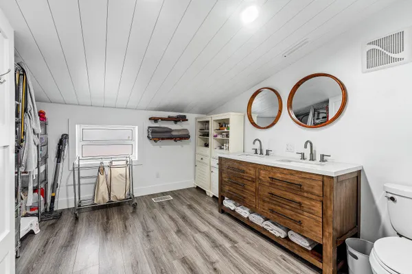 a bedroom with a bed and a night stand