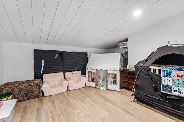 a kitchen with stainless steel appliances granite countertop a refrigerator and a stove