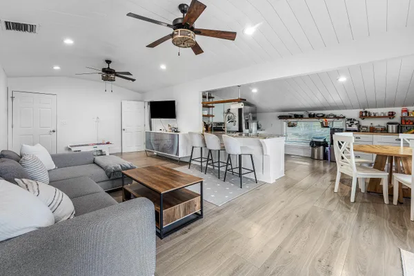 a view of a workspace with furniture and window