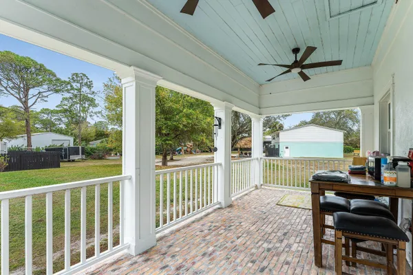 a kitchen with a stove a sink and a refrigerator
