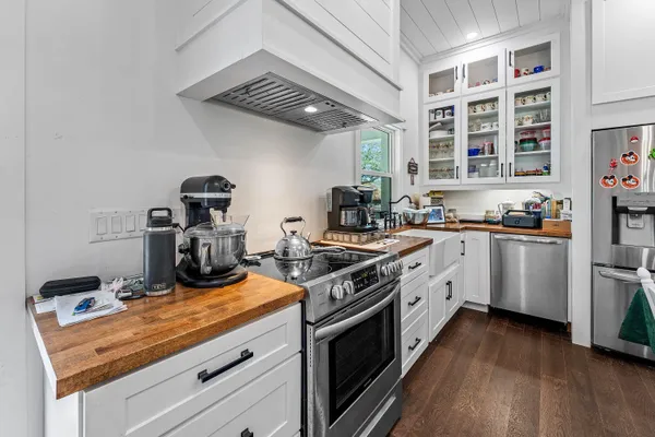 a bedroom with a bed and painting on the wall