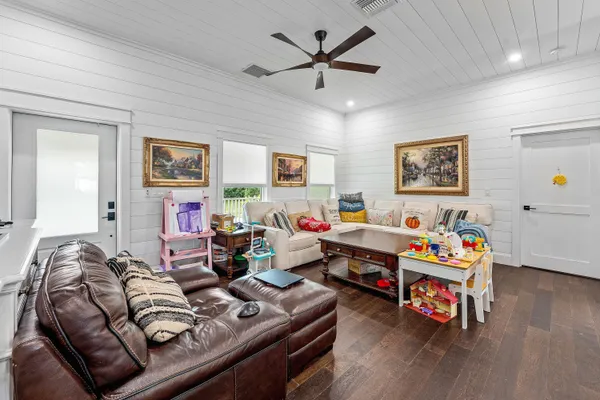 a bedroom with a bed and a lamp on the dresser