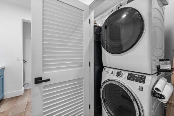 a view of a house with backyard and a tree