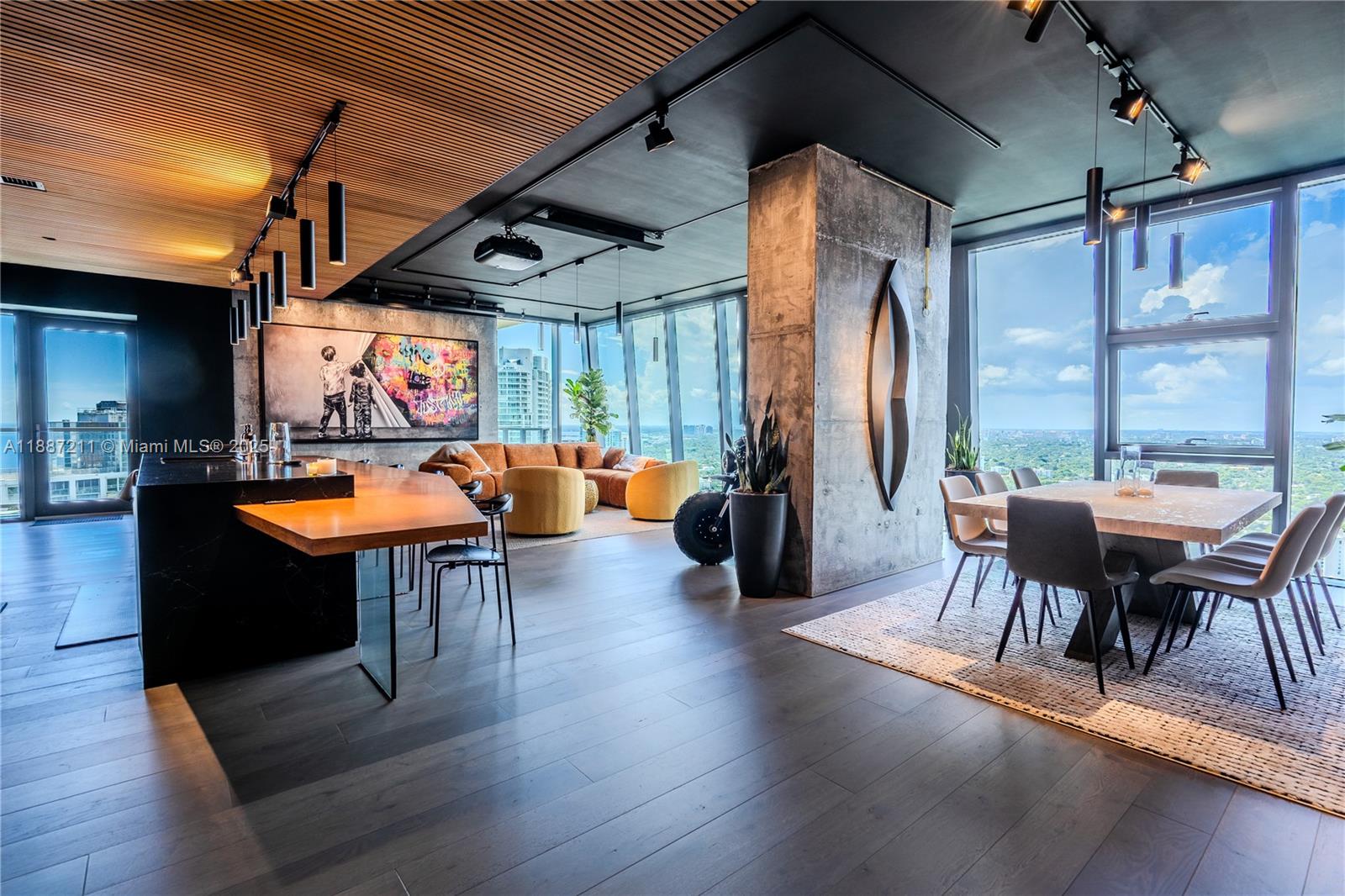1451 Brickell Avenue, Unit 3903 Miami, FL 33131 - Photo 1 of 44 a view of a dining room with furniture window and wooden floor
