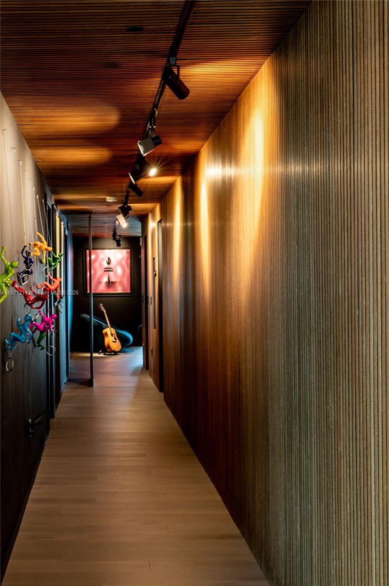 1451 Brickell Avenue, Unit 3903 Miami, FL 33131 - Photo 15 of 44 a view of a hallway with wooden floor