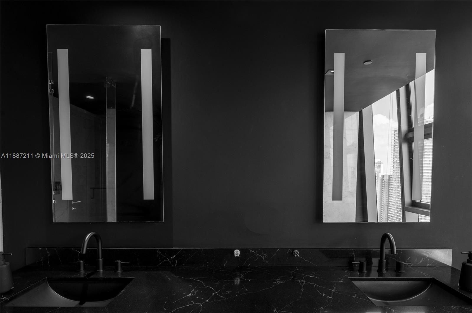 1451 Brickell Avenue, Unit 3903 Miami, FL 33131 - Photo 22 of 44 a bathroom with a sink and a mirror