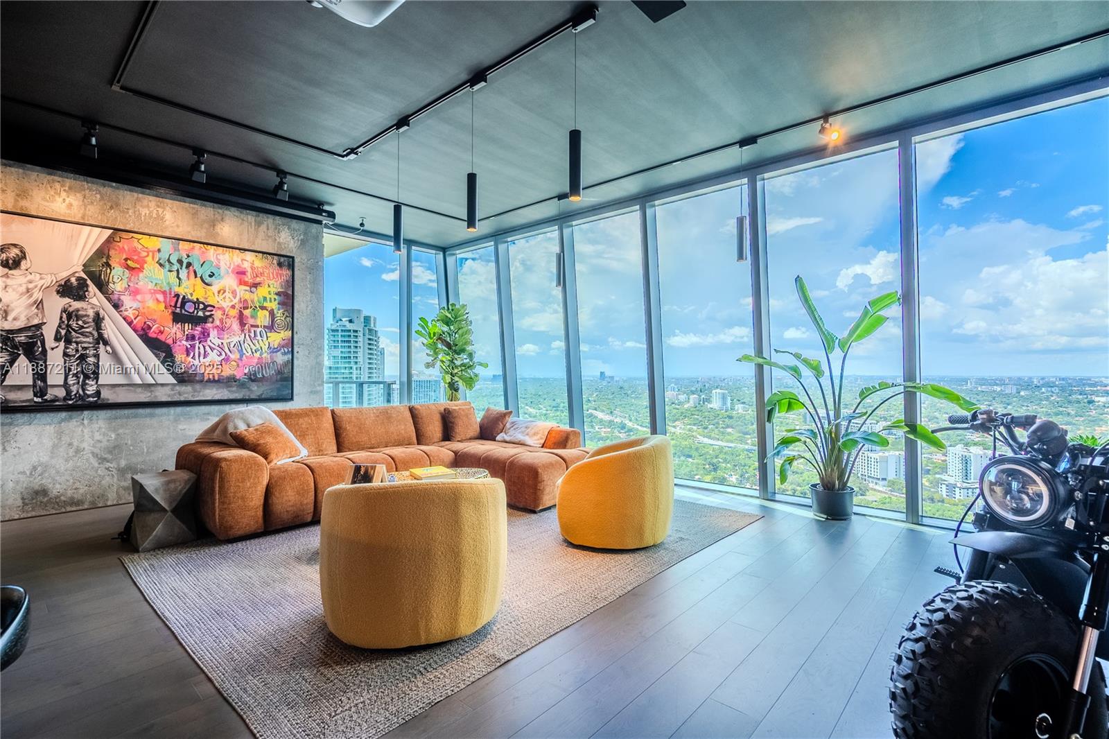 1451 Brickell Avenue, Unit 3903 Miami, FL 33131 - Photo 3 of 44 a living room with furniture and a large window