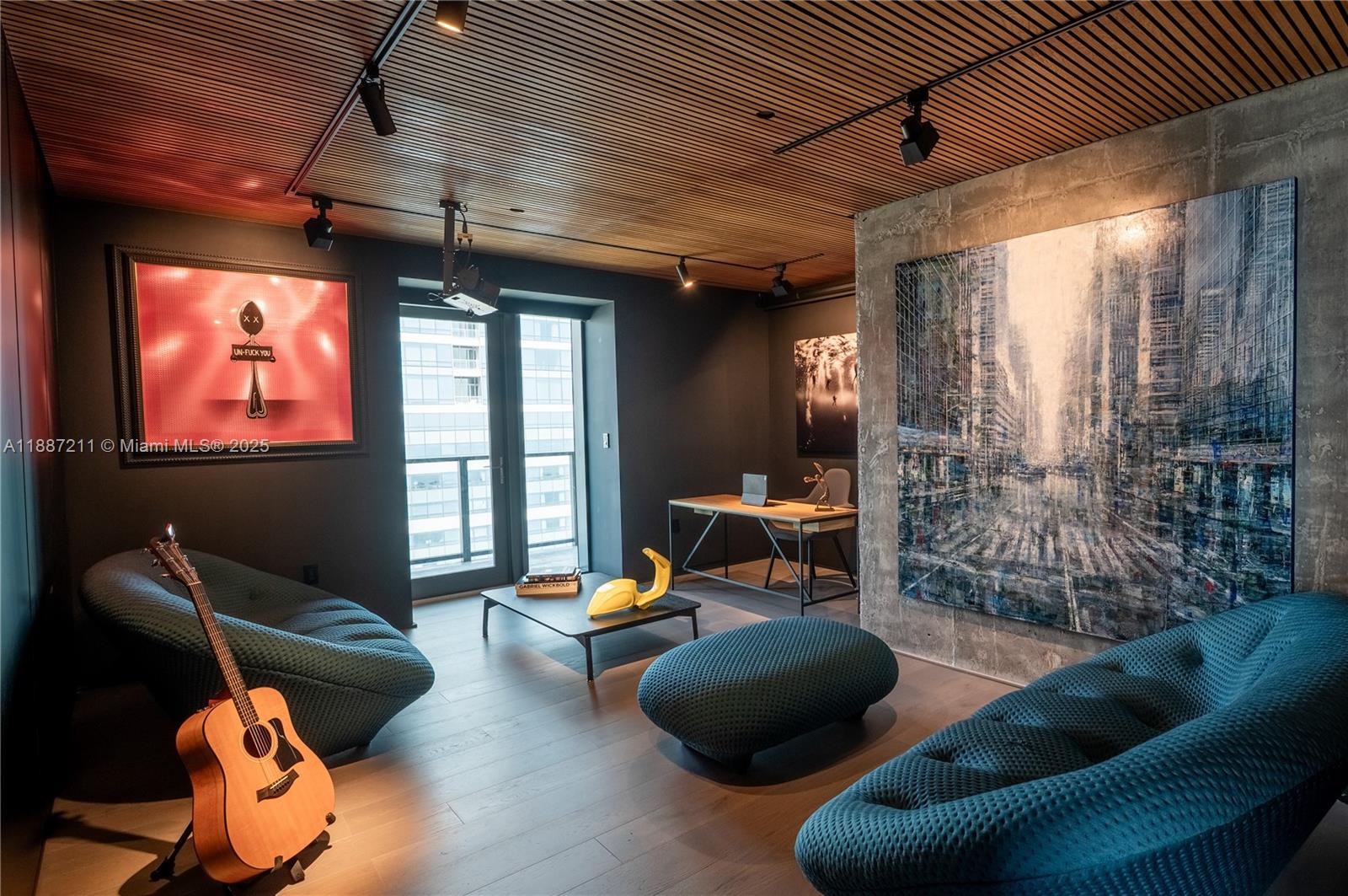 1451 Brickell Avenue, Unit 3903 Miami, FL 33131 - Photo 31 of 44 a living room with furniture and a flat screen tv