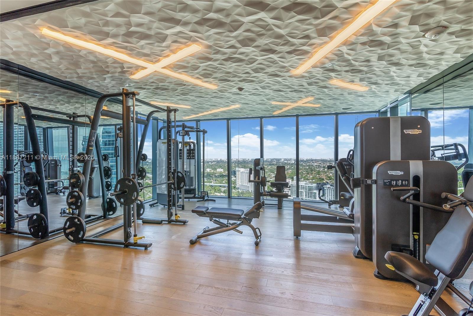 1451 Brickell Avenue, Unit 3903 Miami, FL 33131 - Photo 38 of 44 a view of a room with gym equipment