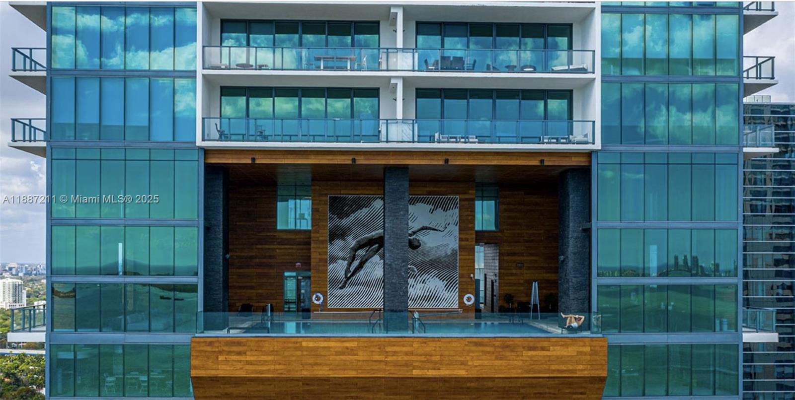 1451 Brickell Avenue, Unit 3903 Miami, FL 33131 - Photo 42 of 44 a view of brick house with large windows and a table