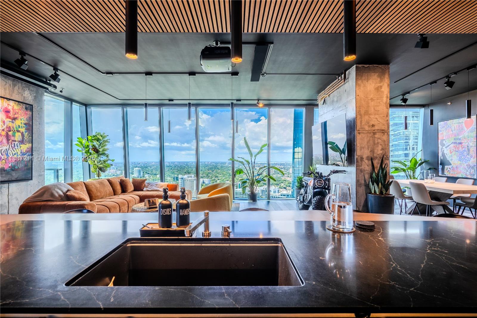 1451 Brickell Avenue, Unit 3903 Miami, FL 33131 - Photo 7 of 44 a room with furniture and a large window