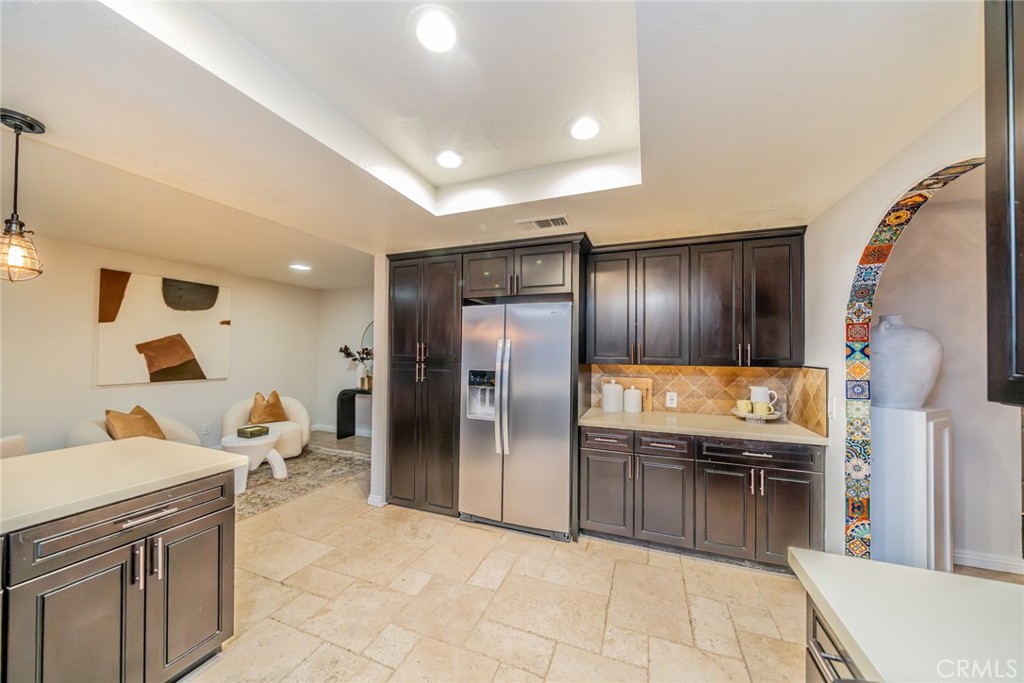 5300 Vía San Jacinto Riverside, CA 92506 - Photo 18 of 59 a kitchen with stainless steel appliances granite countertop a sink and a refrigerator