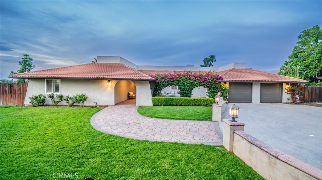 5300 Vía San Jacinto Riverside, CA 92506 - Photo 2 of 59 a front view of a house with a yard and garage