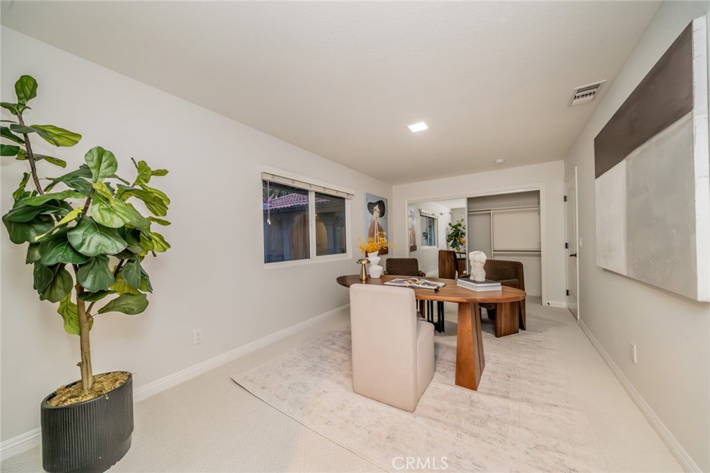 5300 Vía San Jacinto Riverside, CA 92506 - Photo 25 of 59 a living room with furniture a potted plant and a table
