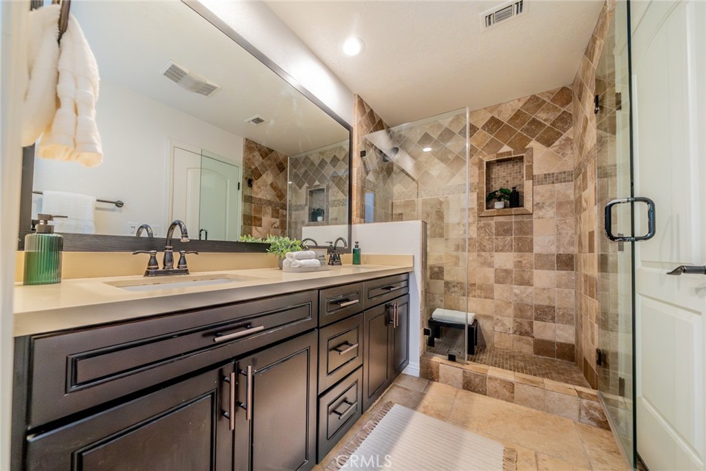 5300 Vía San Jacinto Riverside, CA 92506 - Photo 31 of 59 a spacious bathroom with a sink double vanity and a mirror
