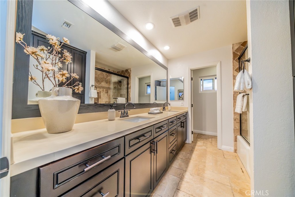 5300 Vía San Jacinto Riverside, CA 92506 - Photo 38 of 59 a large kitchen with stainless steel appliances granite countertop a lot of counter space and a sink