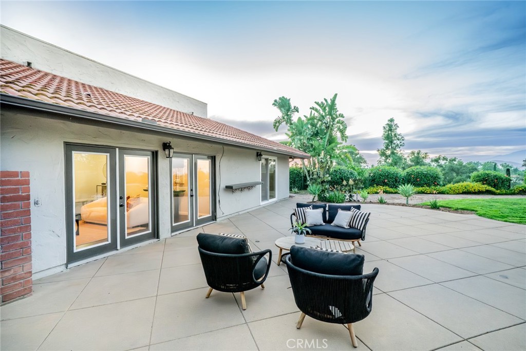 5300 Vía San Jacinto Riverside, CA 92506 - Photo 41 of 59 a view of a patio with couches chair and potted plants
