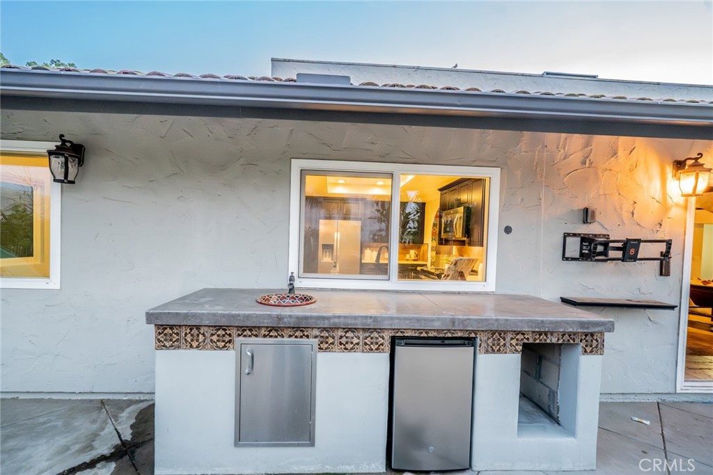 5300 Vía San Jacinto Riverside, CA 92506 - Photo 46 of 59 a bathroom with a granite countertop sink and a mirror