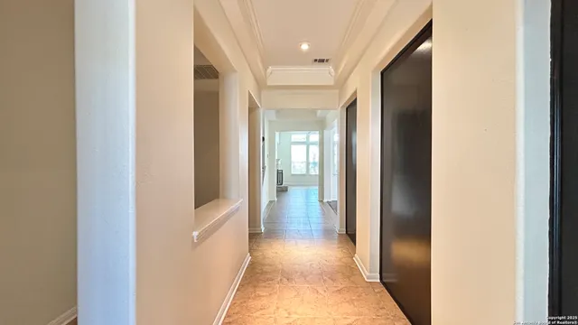 a view of a hallway with a wooden floor