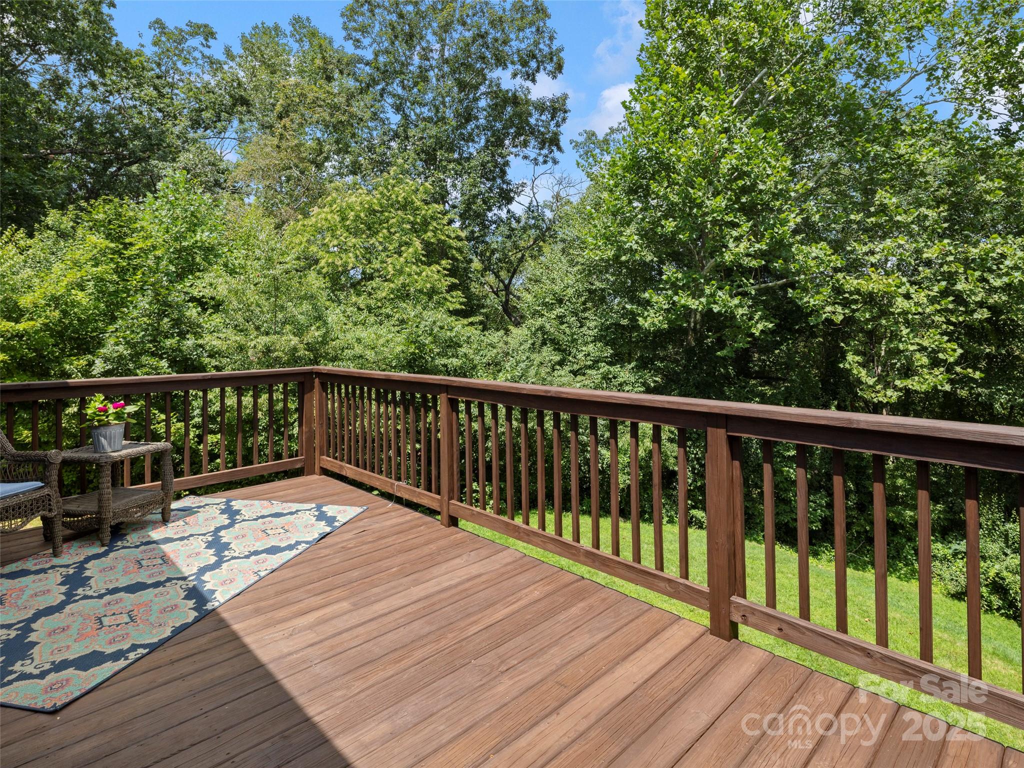269 Adams Drive Clyde, NC 28721 - Photo 17 of 32 a view of balcony with wooden floor and fence