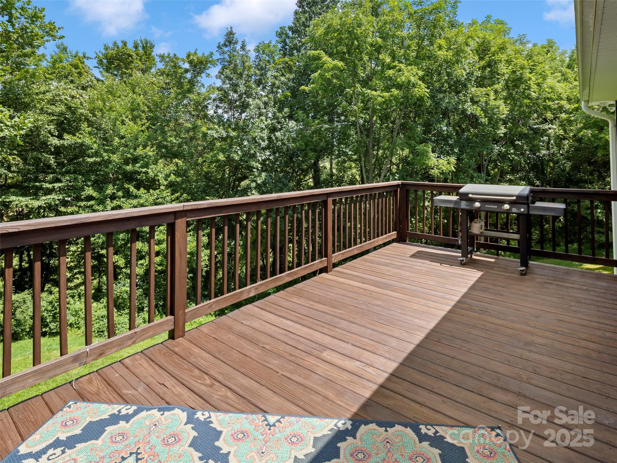 269 Adams Drive Clyde, NC 28721 - Photo 18 of 32 a balcony with wooden floor and fence