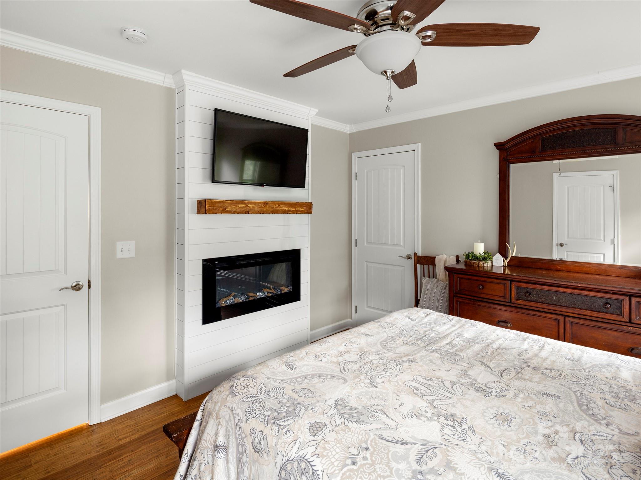 269 Adams Drive Clyde, NC 28721 - Photo 19 of 32 a bedroom with a bed and a television