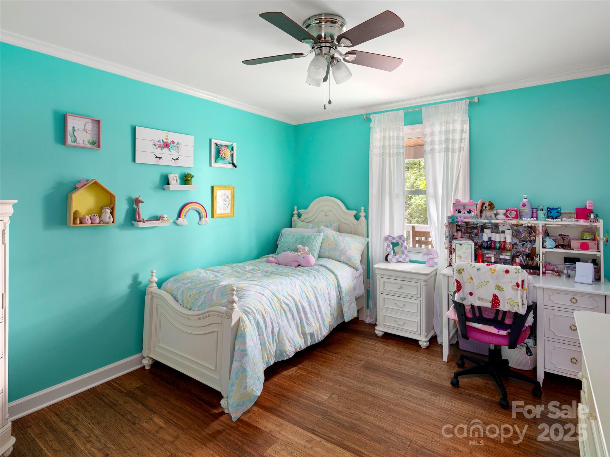 269 Adams Drive Clyde, NC 28721 - Photo 22 of 32 a bedroom with a bed and a window