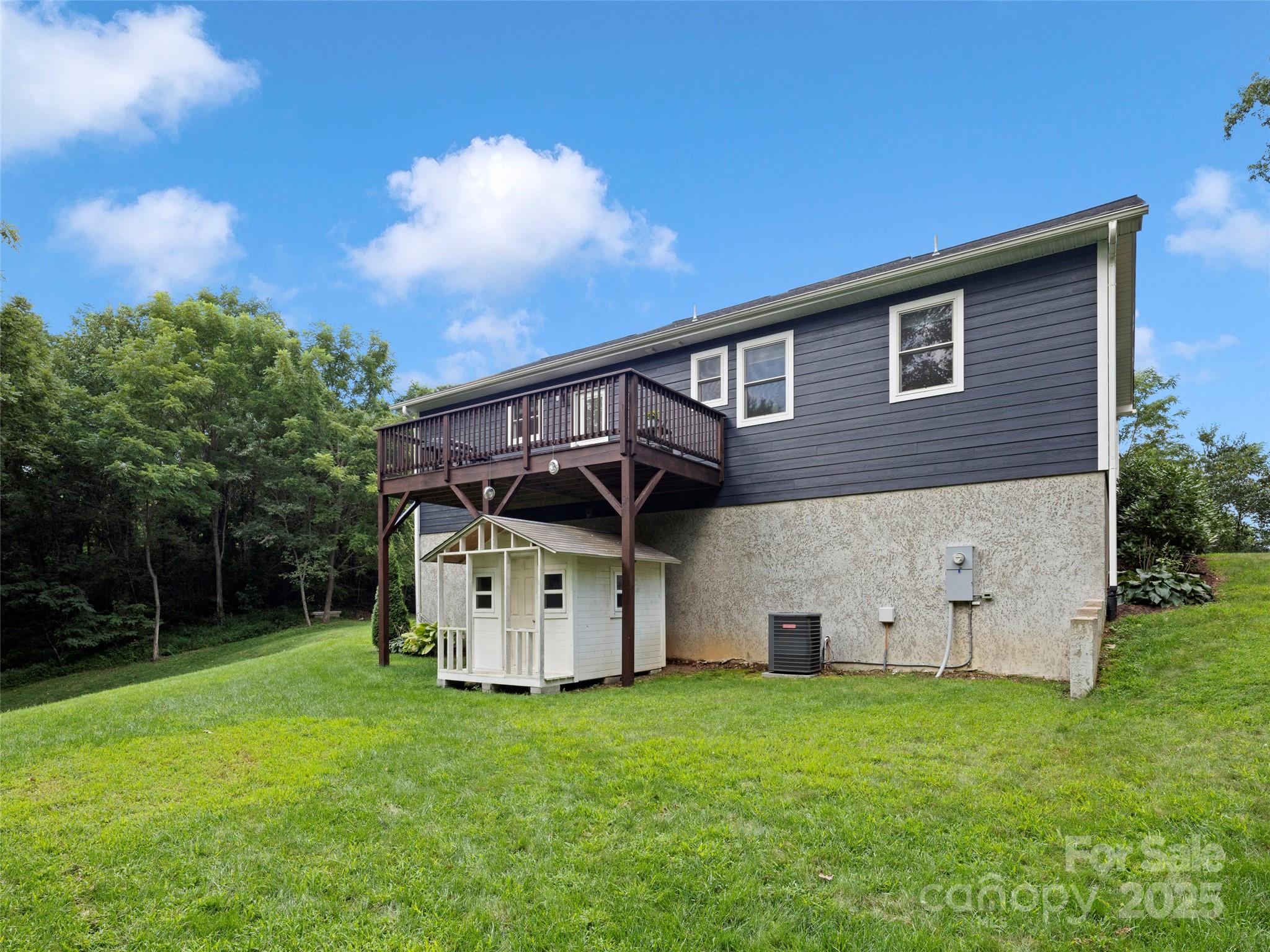 269 Adams Drive Clyde, NC 28721 - Photo 31 of 32 a view of a house with backyard