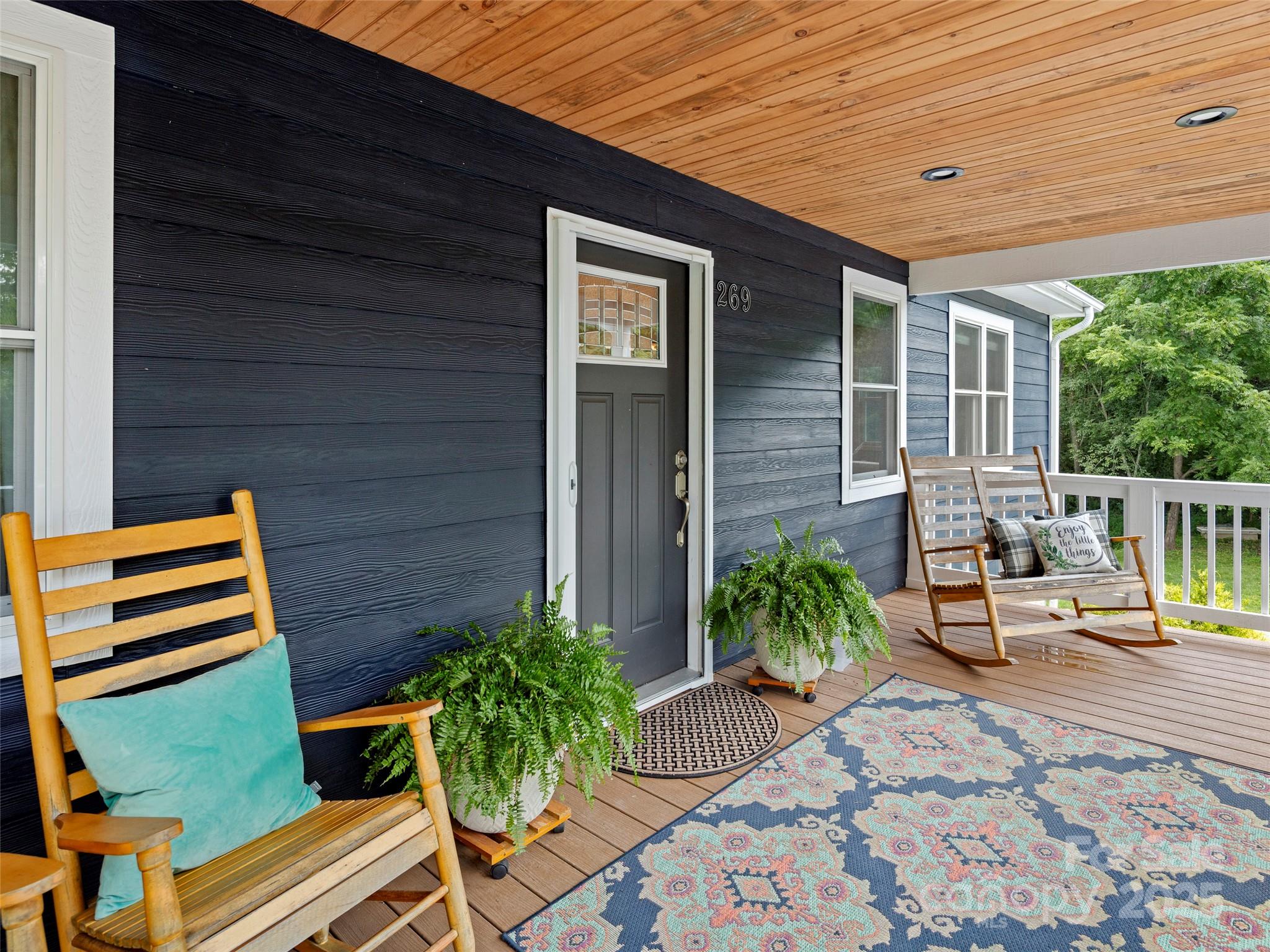 269 Adams Drive Clyde, NC 28721 - Photo 6 of 32 a backyard of a house with seating space