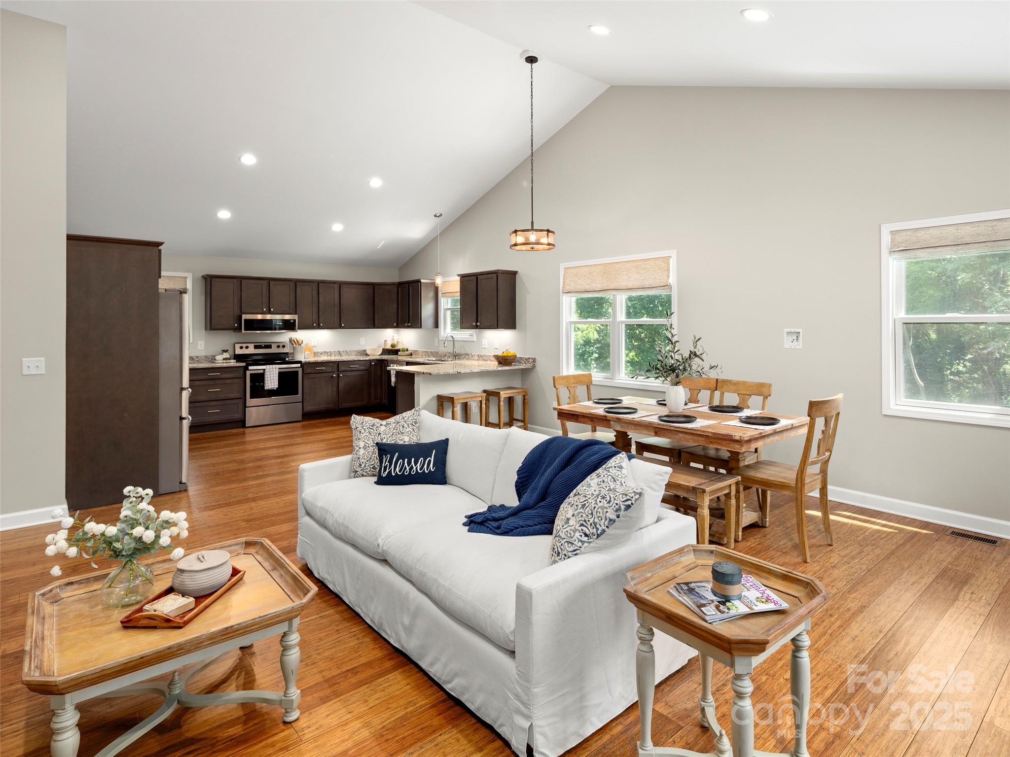 269 Adams Drive Clyde, NC 28721 - Photo 8 of 32 a living room with furniture and a large window